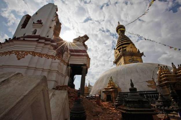 One of Nepals oldest and most venerated shrines, the Swayambunath temple complex suffered damage in the April 25th and May 12th earthquakes. Conservators hope to shore up the main stupa before monsoon rains arrive.  PHOTOGRAPH BY NIRANJAN SHRESTHA, AP